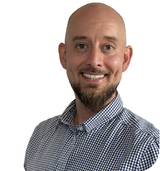 Man in checkered shirt, neutral background.