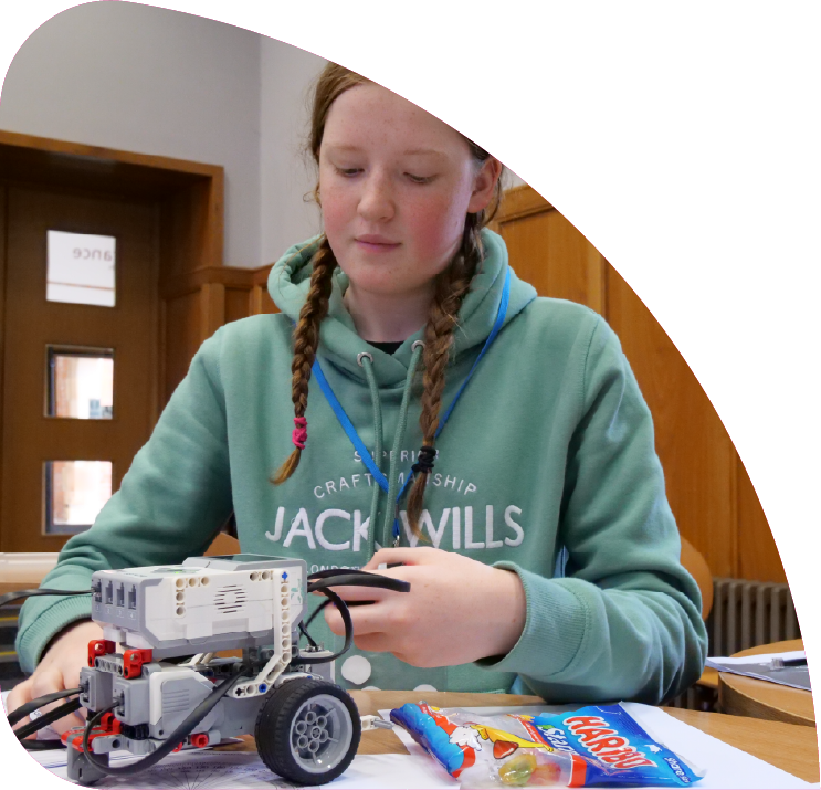 Child working on robotics project.