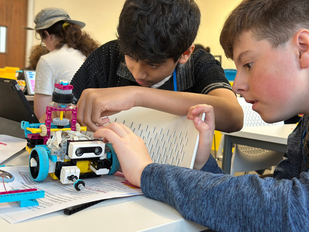 Children building a colorful robot.