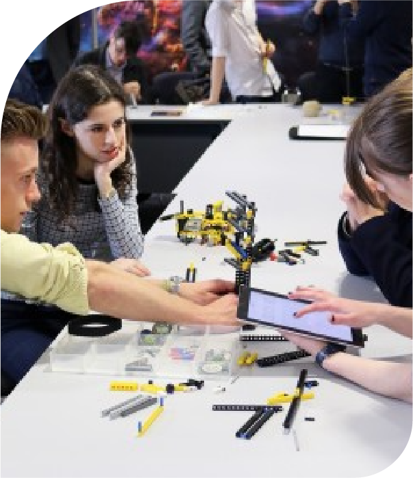 Collaborative building with LEGO pieces.